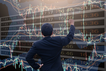 Fototapeta premium Double exposure business man using technology stock financial indices on currency exchange