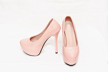 Female pink shoes with high heels.