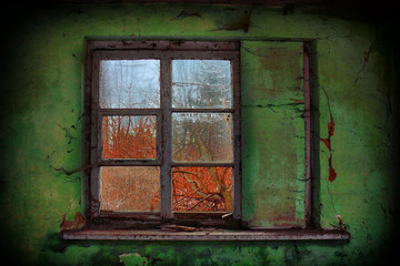 Old broken window with old painted green wall