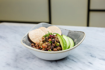 Legumes salad with crackers and avocado
