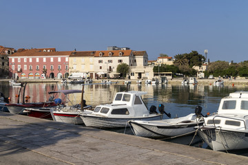 Supetar port with small fishing boats, biggest town on Brac island in Croatia