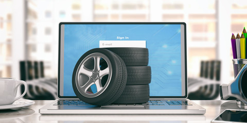 Car tires and rims on a laptop - office background. 3d illustration