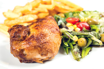 Fresh chicken with tomatoes and french fries