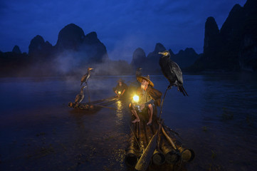 Fisherman of Guilin, Li River and Karst mountains during the blue hour of dawn,Guilin China