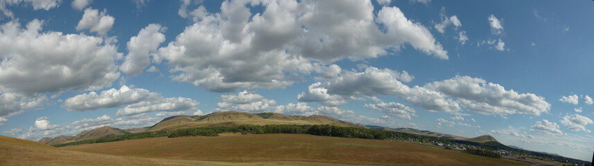 Fototapeta premium Summer clouds and mountains