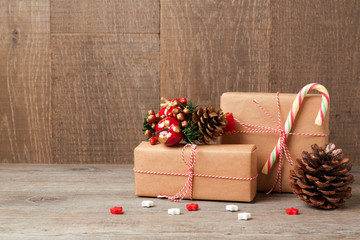 Christmas celebration concept with gift boxes over wooden background