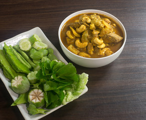 Fish paunch spicy curry and hot together with fresh vegetable, (Thai food, and thai language 