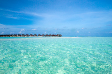 Naklejka na ściany i meble beach with water bungalows at Maldives