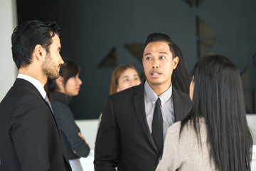 Asian businessmen working together at office place, people working concept, vintage tone.