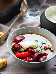 Beetroot soup served in bowls on napkin. Lunch with light vegetarian dish