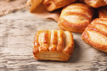 Delicious pastries on wooden table