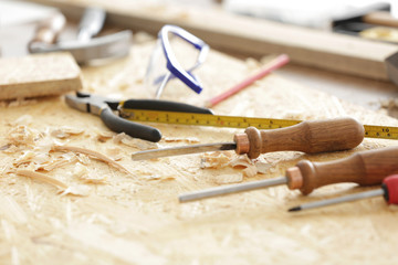 Naklejka premium Table with tools in carpenter's workshop, closeup