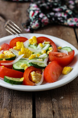 Vegetable salad, tomatoes, onions, cucumber, corn