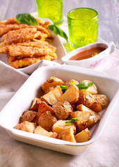 Roast potatoes in a tin