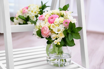Beautiful bouquet with freesia flowers near mirror