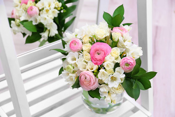 Beautiful bouquet with freesia flowers near mirror