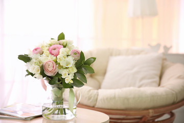 Beautiful bouquet with white freesia on table at home