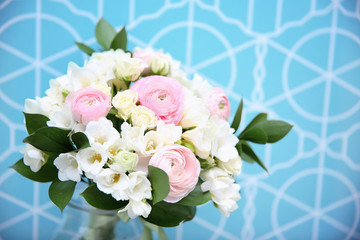 Beautiful bouquet with white freesia on color background