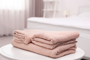 Clean towels on the table in room