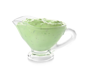 Delicious yogurt sauce in gravy boat isolated on white