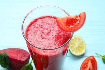 Glass of fresh vegetable smoothie on wooden table
