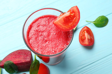 Glass of fresh vegetable smoothie on wooden table