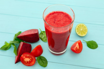 Glass of fresh vegetable smoothie on table