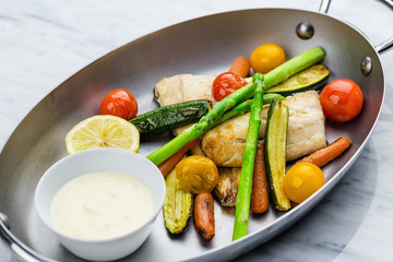 Grilled fish and vegetables with sauce