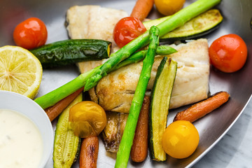 Grilled fish and vegetables with sauce