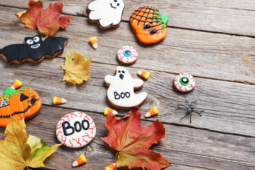 Fresh halloween gingerbread cookies on grey wooden table