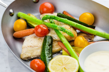 Grilled fish and vegetables with sauce