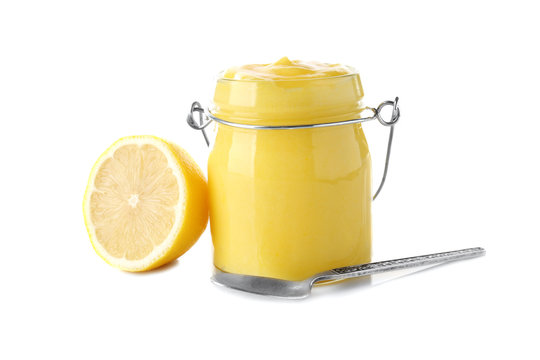 Glass Jar With Yummy Lemon Curd On White Background