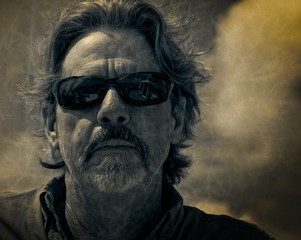 Badass Man in Sunglasses Stares into the Unknown, desaturated