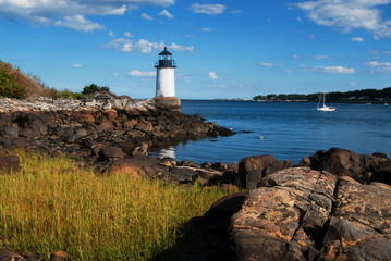 Fototapeta na wymiar Fort Pickering (Winter Island) lighthouse in Salem Harbor, Massachusetts in late afternoon.