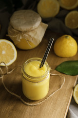 Beautiful composition with delicious lemon curd on table