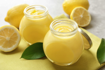 Beautiful composition with delicious lemon curd on table