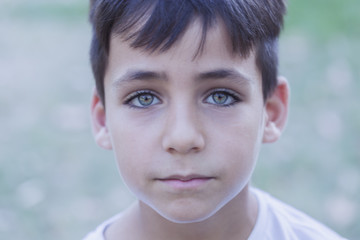 Fototapeta na wymiar Boy with beautiful green eyes