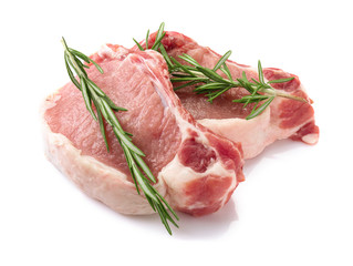 Raw steaks with rosemary isolated on white
