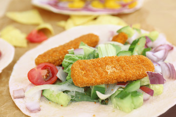 Delicious fish taco on parchment, closeup