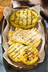 Barbecue cheese patties - oval goat's sheep milk with herb marinade, two round herb and paprika marinade and slices of halloumi cheese - 163585740