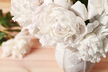 Closeup view of peonies on blurred background