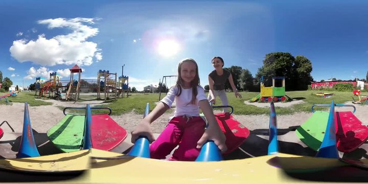 360 Video VR Mother with Child Girl Daughter on Merry-Go-Round having Fun Outdoors on Summer
