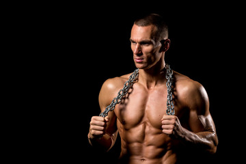 fitness muscular male model with chains