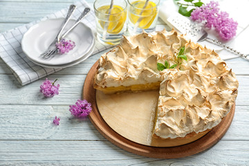 Yummy lemon meringue pie on wooden table