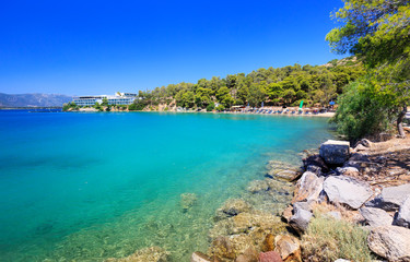 Fototapeta na wymiar Travel Greece. Spectacular view on one of the most beautiful beaches in Poros Island. Summer holiday