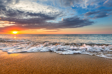 Fototapeta na wymiar Dramatic Tropical Sunrise at the beach