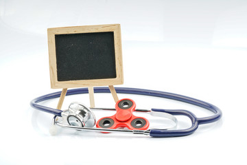 Fidget spinner with autistic therapy concept