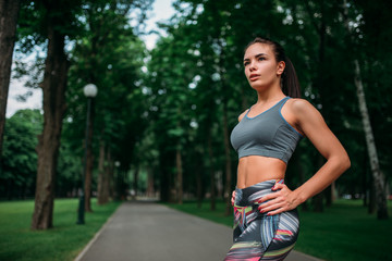 Slim girl in sportswear, outdoor fitness training