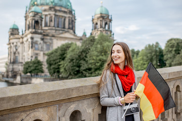 Young woman tourist traveling with photo camera near the famous cathedral in Berlin city © rh2010