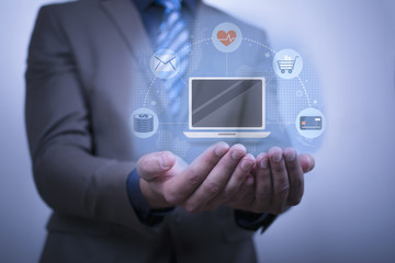 Close up of businessman's hand holding a hologram. A business person working with modern virtual technology.
